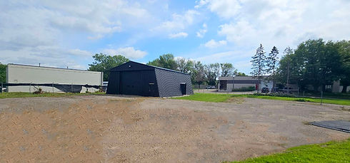 Exterior view warehouse and surrounding property.