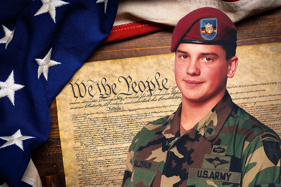 U.S. soldier (Jeff) in camouflage stands in front of the Constitution text and a folded American flag. Mood is patriotic. "We the People" is visible.