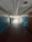 School hallway with lockers, drinking fountain, doors