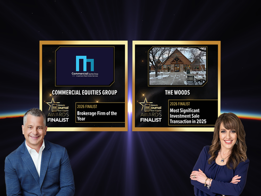 Two people smiling, standing beside award plaques for Commercial Equities Group and The Woods. Dark backdrop with radiant light.