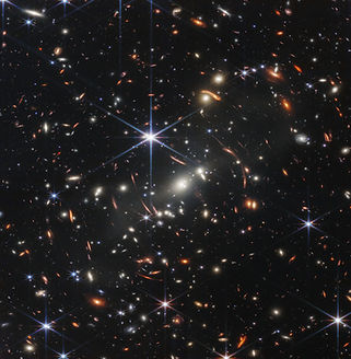NASA image from James Webb Space Telescope; bright shapes and specs; sharpest images of the universe