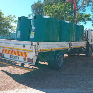 A truck with green domes for glass collection