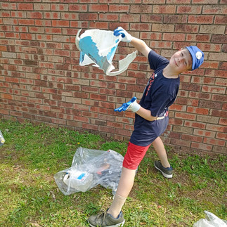 Ethan sorting out the recycling materials