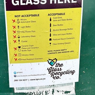 The Recycling Kid depositing glass bottles into the glass recycling dome