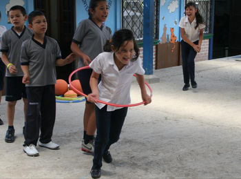 Children playing games with volunteers.