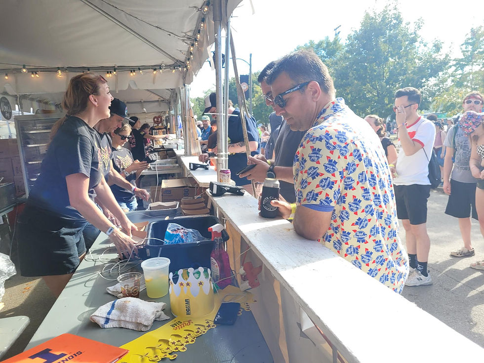 Person at Payment Terminal in Chicago Street Festival