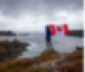woman on rock w flag.jpg