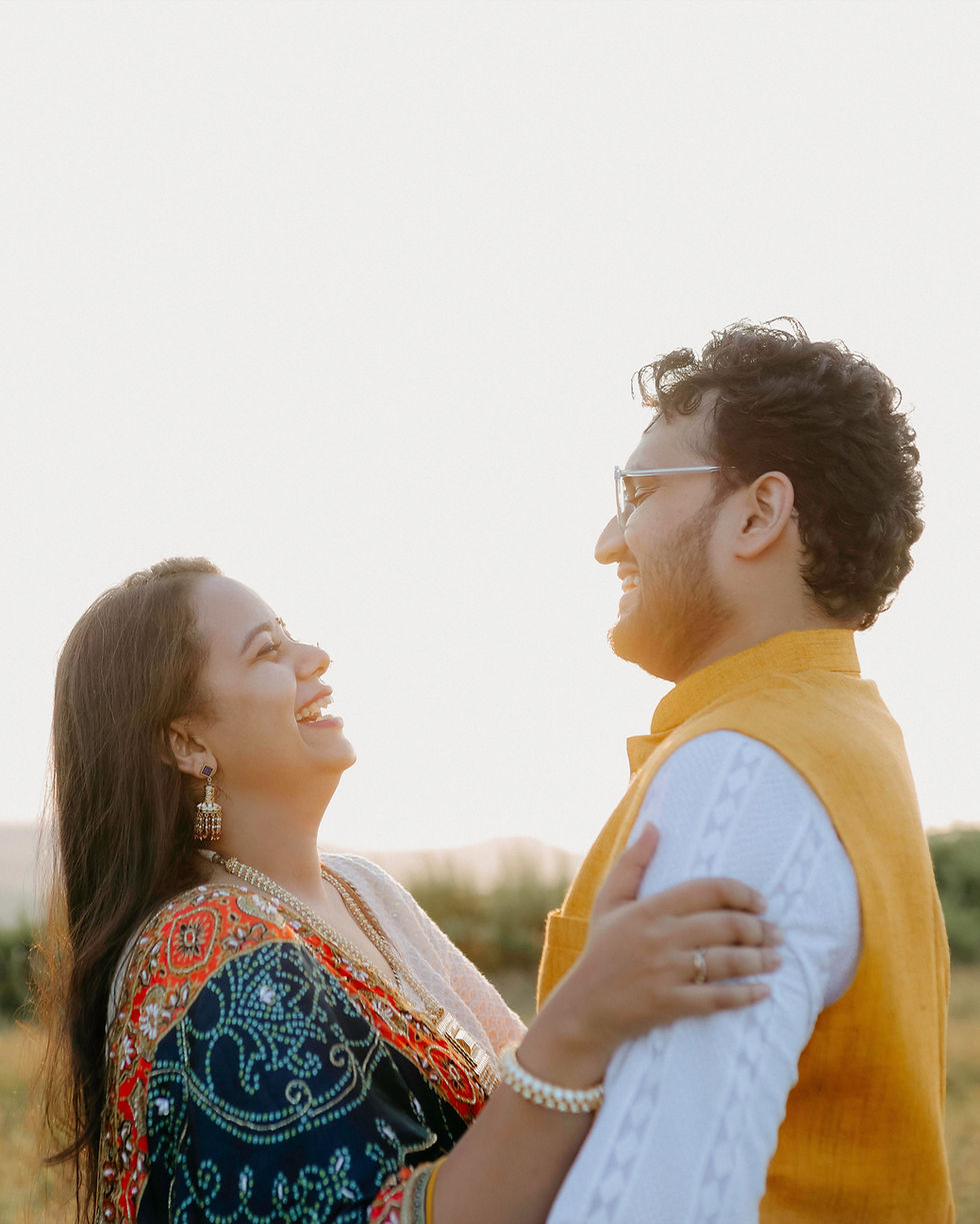 Couple sharing a laugh during a wedding shoot in Ahmedabad