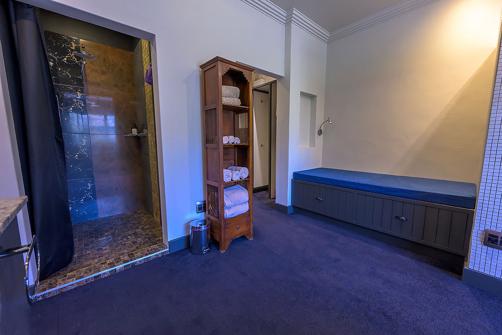 The Residency bedroom featuring shower and dressing space