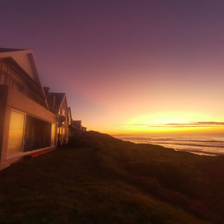 House with a ocean sunset in the background.jpeg