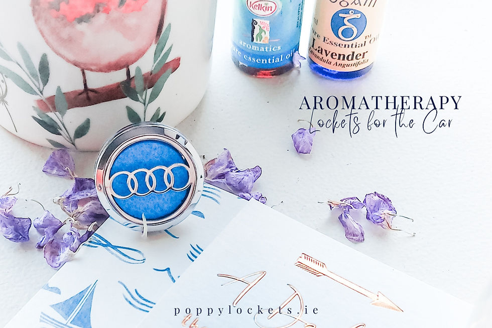 Aromatherapy car locket with blue pad, surrounded by purple petals, essential oil bottles, and floral decor. Text: "Aromatherapy Lockets for the Car". URL: poppylockets.ie