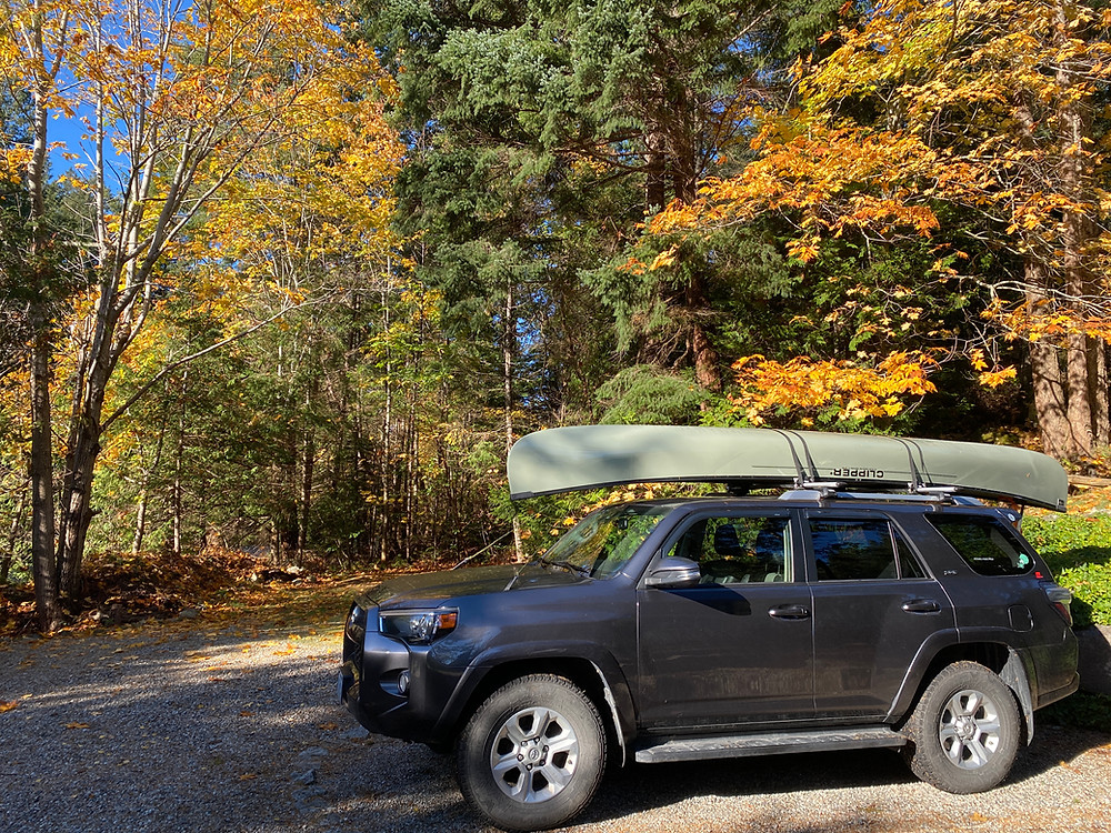 Toyota 4Runner with a canoe on top.