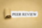 Sheet of brown paper with section rolled back to expose the words "Peer Review"