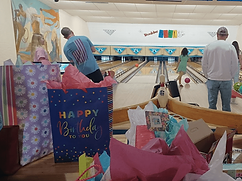 Boulder Bowl, Bowling Alley in Boulder City, Nevada, USA - PARTY PHOTO, CHILDREN BOWLING WITH GIFTS IN THE FOREGROUND, SET IN BOULDER BOWL