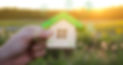 Miniature house and symbols of public utilities. Choosing a home to buy, assessing the cos