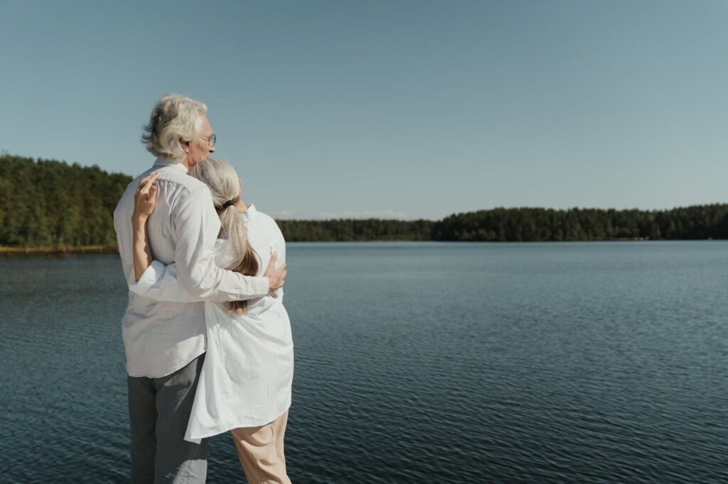 couple looking at lake - Waterfront land for sale near me