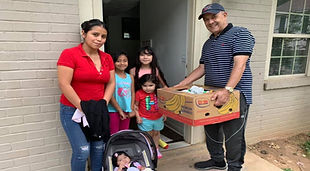 Eduardo Delivering Food to a Family in D