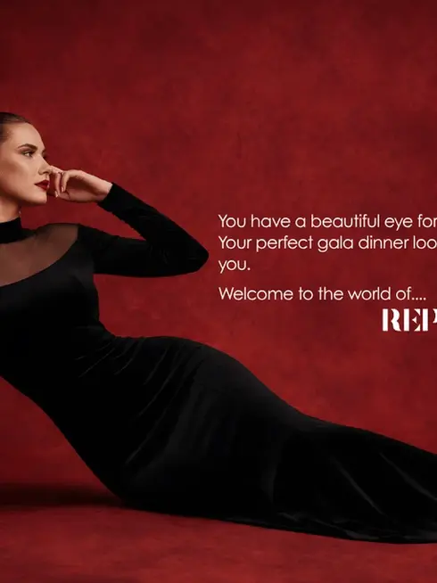 Woman in a long black evening gown reclining against a deep red backdrop, with text inviting readers to discover REPULO’S gala dinner style.