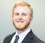 Picture of man with red hair with a business suit on
