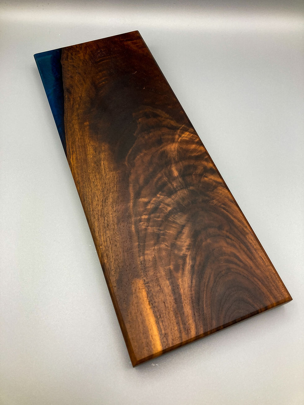 Thumbnail: (SOLD) Figured Black Walnut with Blue Epoxy Charcuterie Board