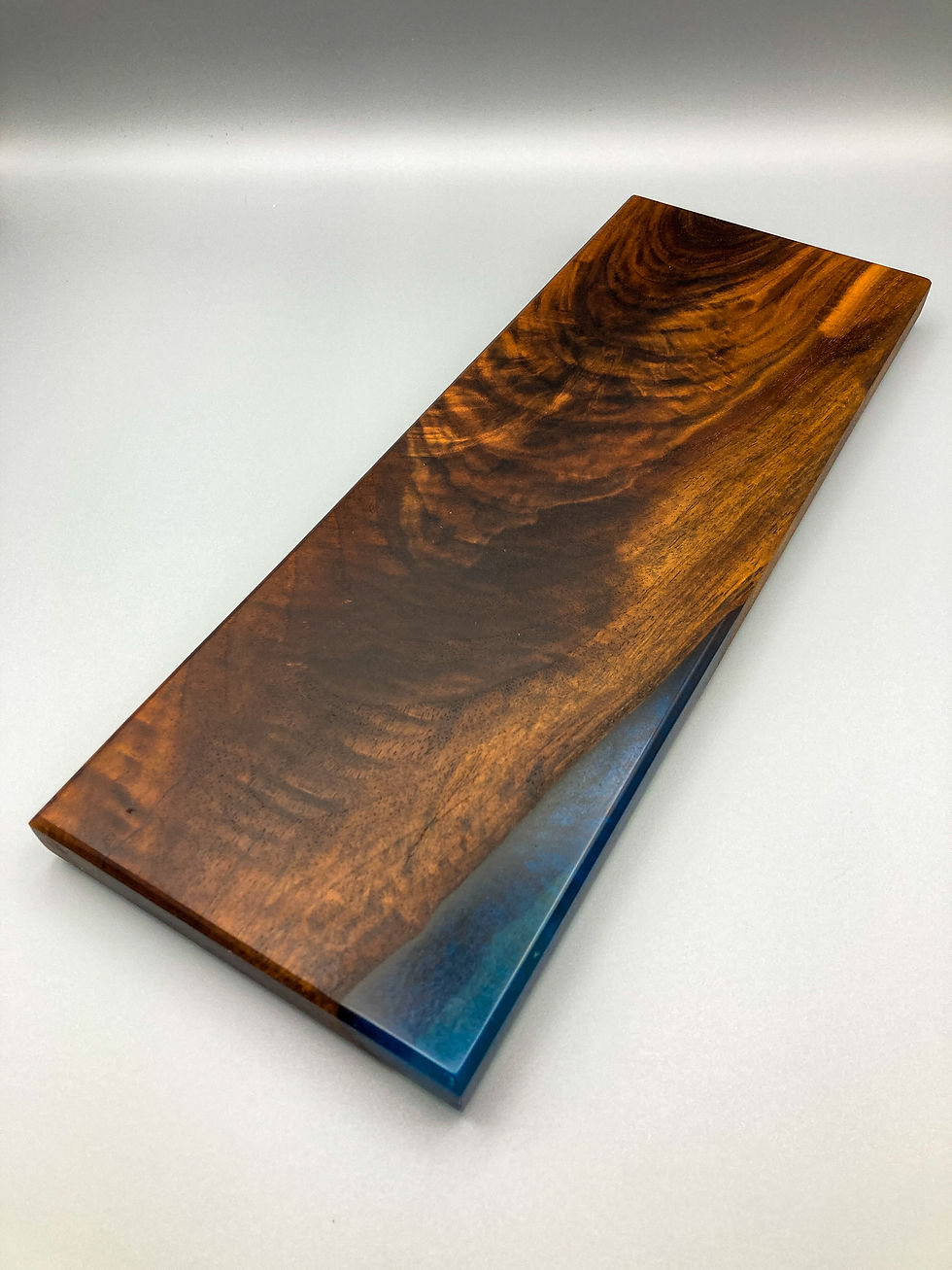 Thumbnail: (SOLD) Figured Black Walnut with Blue Epoxy Charcuterie Board