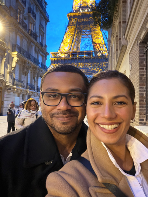Eiffel Tower light at night. taking a selfie on a walking tour of Paris on foot.