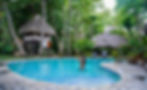 woman swimming at a pool in Natura Cabana Boutique Hotel and Spa in Cabarete. 
