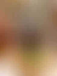 Plate with a Croque Monsieur and two glasses of champagne. in the background we see a stair way leading to the upstairs part of the restaurant.