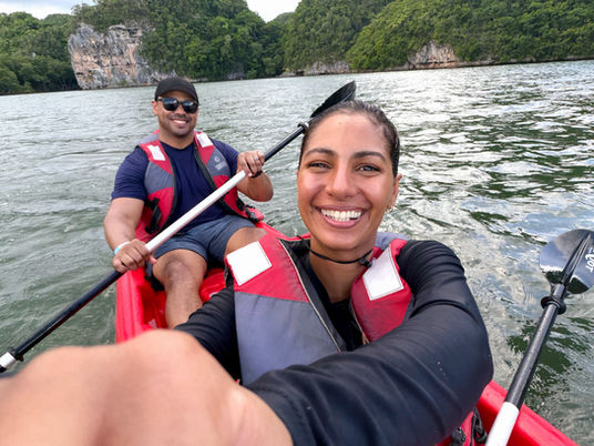 Travel couple kayaking in LOS HAITISES NATIONAL PARK in the Dominican Republic.