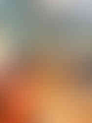 Common sitting are with orange long sofas and light wooden tables. Mirrors frame the teal colored walls. Best restaurants in Chapms des Elysses