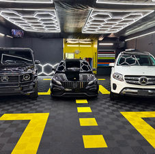 Three Mercedes-Benz vehicles inside Columbus Perfect Tint shop, showcasing ceramic tint, PPF installation, and professional auto styling in Columbus, Ohio.