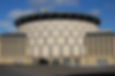 Exterior of the modern EICC building in Edinburgh, featuring its distinctive circular, multi-level 'turret' entrance.