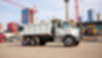 TND Construction Solutions dump truck in Toronto by CN Tower