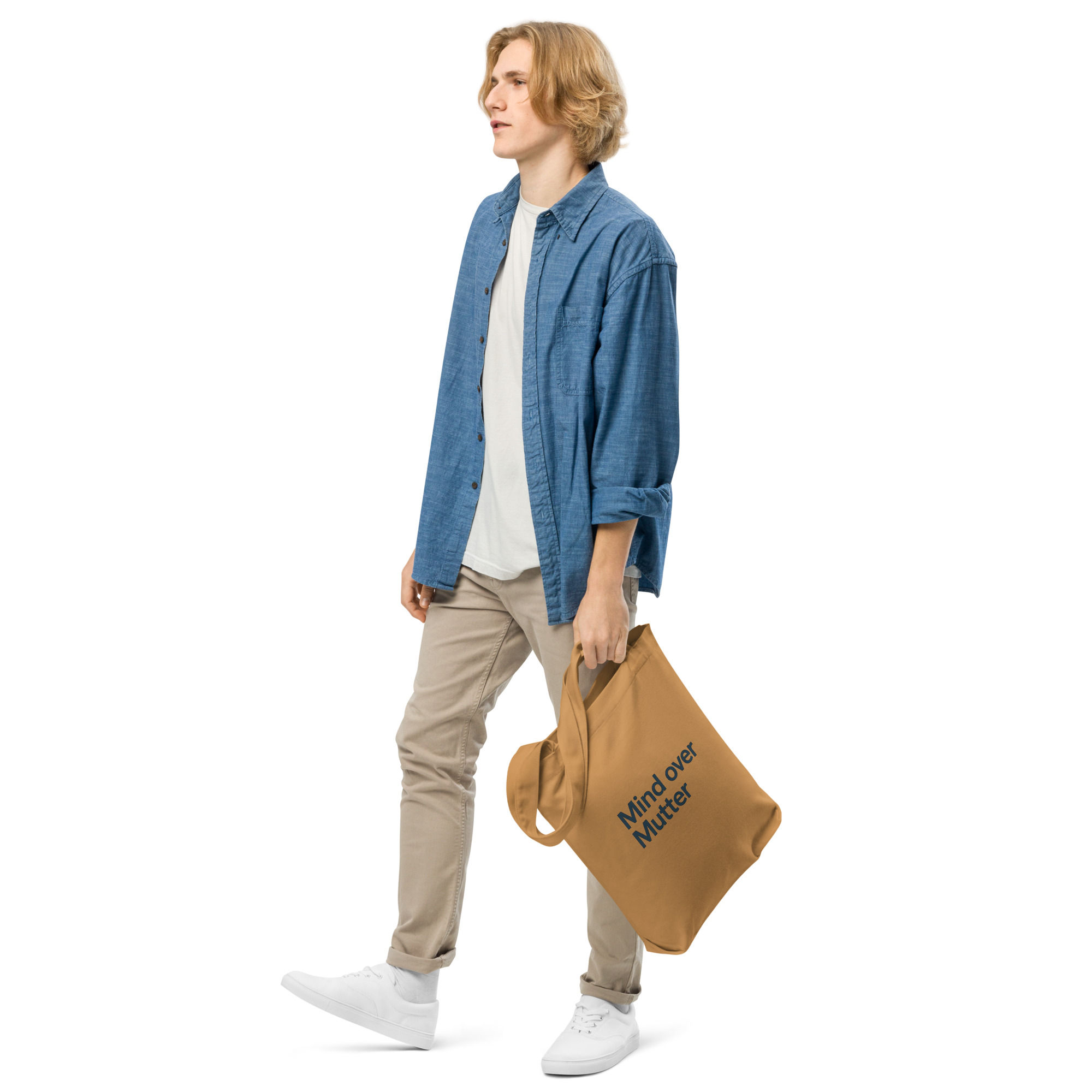 Person walking with a Mind over Mutter cotton tote bag.