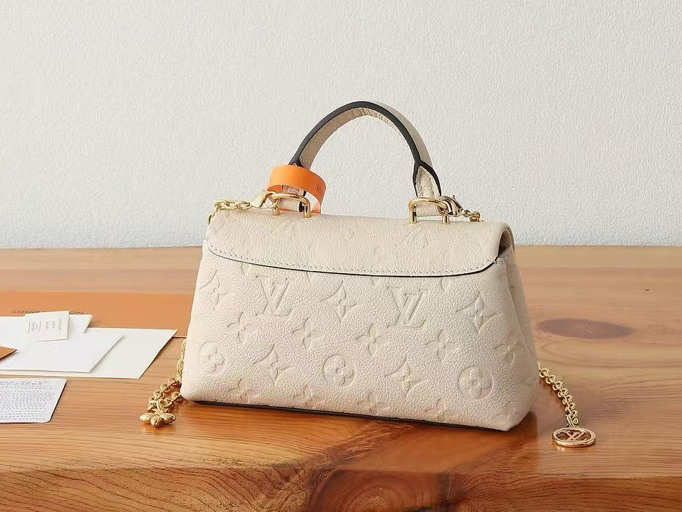 Thumbnail: Louis Vuitton Madeleine BB Empreinte Cream Bag