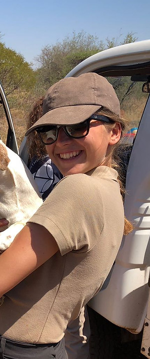 Young Female Conservationist Holding Jack Russell