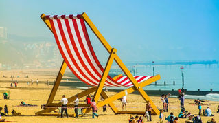 a large deck chair on bournemouth beach, a popular things to do in bournemouth today