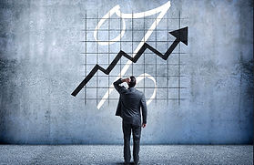 Man scratching head looking at chart pic