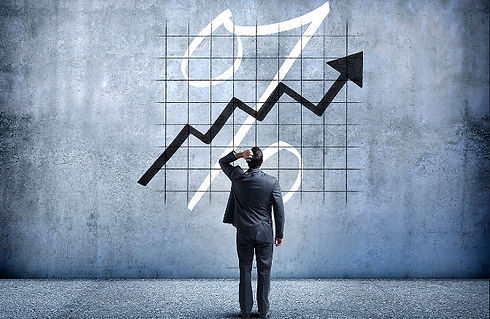 Man scratching head looking at chart pic