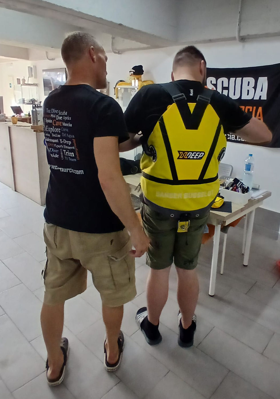 Divers setting up an Xdeep harness
