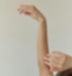 Arm raised against a neutral background, highlighting smooth skin and common areas treated with permanent hair removal.