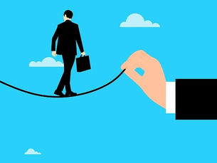 Businessman walking a tightrope