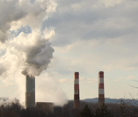 Smokestacks connected to a power plant.