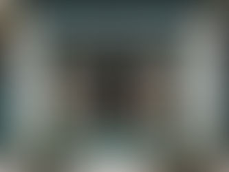 Flower shop doorway surrounded by pots