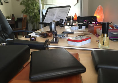 Oboe reeds for sale on a desk.