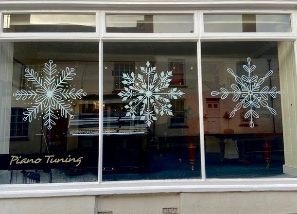 Hand-painted window mural, 1.2m snowflakes. Piano Gallery, Faringdon.
