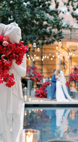 bougainvillea vines on a Grecian statue