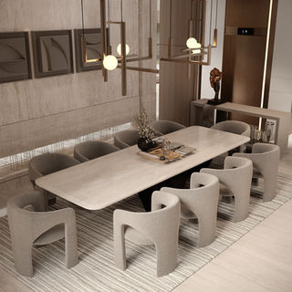 Contemporary dining space featuring bespoke furniture, neutral tones, elegant lighting, and refined material finishes in a luxury villa.