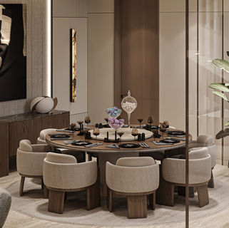 Luxury dining area with round dining table, upholstered chairs, sculptural lighting, and refined contemporary finishes.