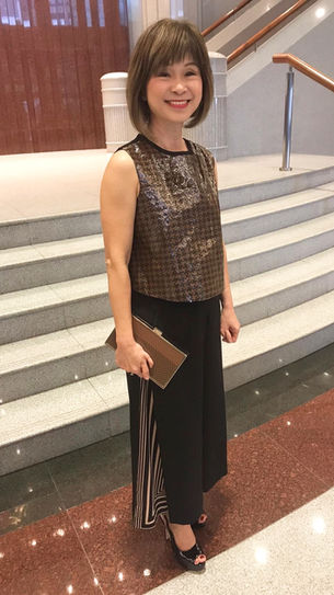 Dr. Amy Khor were MusicCloth blouse and clutch bag on the Singapore Parliament